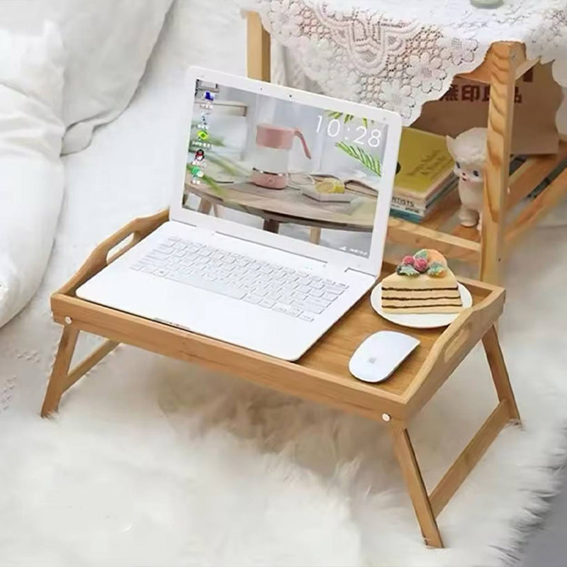 Table pliable en bois pour des moments de confort au lit